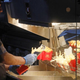 McDonald's worker pouring fries into cartons in Moscow